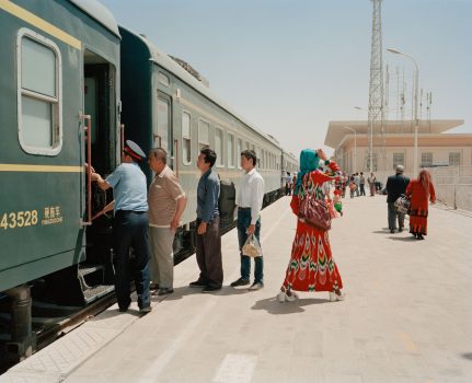 May 2016. Xinjiang province, China. Travellers getting on and off the train to Hotan at the Kashgar railway station. This is the only railway linking the oasis towns south of the Taklamakan desert where most of Xinjiang's Uighur community in Xinjiang lives.
Xinjiang is the westernmost province in all China, located at the border of Central Asian countries, Russia and Mongolia. More than twice the size of France, it has only 22 million inhabitants, a majority of which are the indigenous Uighurs, a sunni-muslim Turkic ethnic group which has lived in the region for centuries. Tensions have nonetheless arisen in the last decade as a consequence of the en-masse migration of Han Chinese settlers and confessional persecution by the strongly secular governmental authorities.
